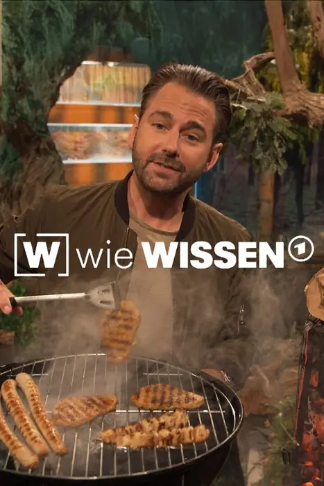 Host of Wie Wissen tends a grill, flipping sausages as smoke rises.